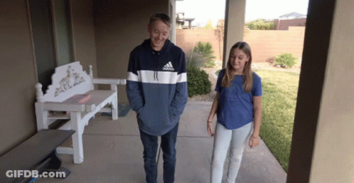 A Boy Wearing An Adidas Sweatshirt Stands Next To A Girl On A Porch GIF