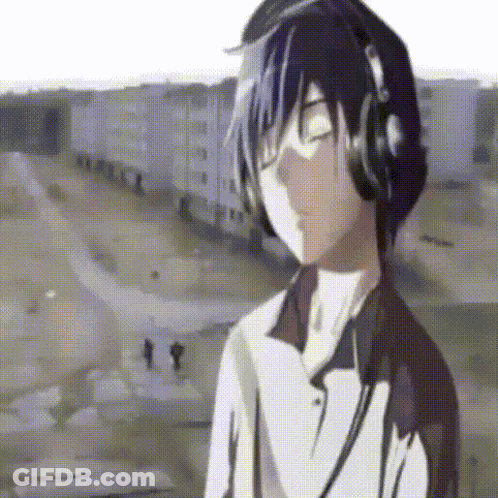 A Boy Wearing Headphones Is Listening To Music GIF