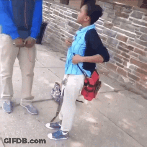 A Boy With A Backpack Is Talking To A Man GIF