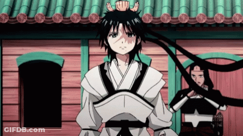A Boy With A Crown On His Head Is Standing In Front Of A Building GIF