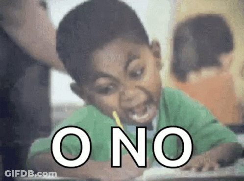 A Boy With A Pencil In His Mouth Is Sitting At A Desk With The Word O No Written In White GIF