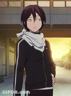 A Boy With A Scarf Around His Neck Is Wearing A Black Jacket And Black Pants GIF