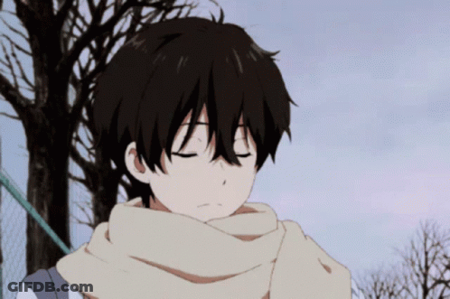 A Boy With A Scarf Around His Neck Looks Down At Something GIF