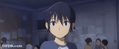 A Boy With A Surprised Look On His Face Is Standing In Front Of A Bulletin Board GIF