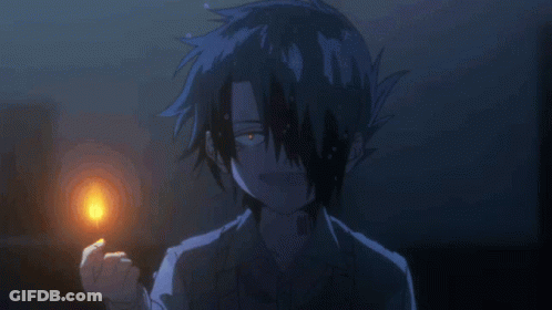 A Boy With A Tattoo On His Forehead Holds A Lit Match GIF