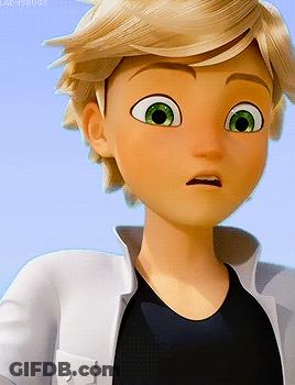 A Boy With Blonde Hair And Green Eyes Is Wearing A Black Shirt And A White Jacket GIF