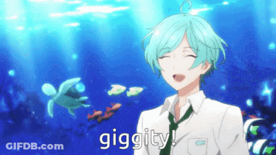A Boy With Blue Hair Is Smiling In Front Of A Turtle In The Ocean And The Word Giggity Is On The Bottom GIF