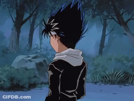 A Boy With Blue Hair Is Standing In A Forest GIF