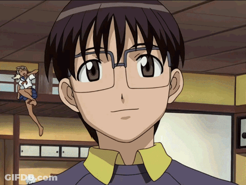 A Boy With Glasses And A Yellow Collar Is Looking At The Camera GIF