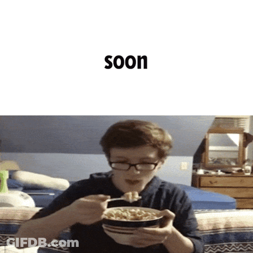 A Boy With Glasses Is Eating A Bowl Of Cereal With The Word Soon Behind Him GIF