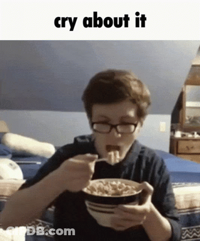 A Boy With Glasses Is Eating A Bowl Of Cereal With The Words Cry About It Above Him GIF