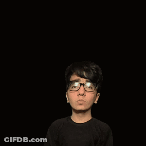 A Boy With Glasses Is Holding Up His Fist In Front Of A Green Triangle GIF