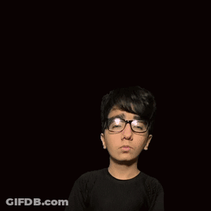 A Boy With Glasses Is Standing In Front Of A Pink Letter F On A Pink Background GIF