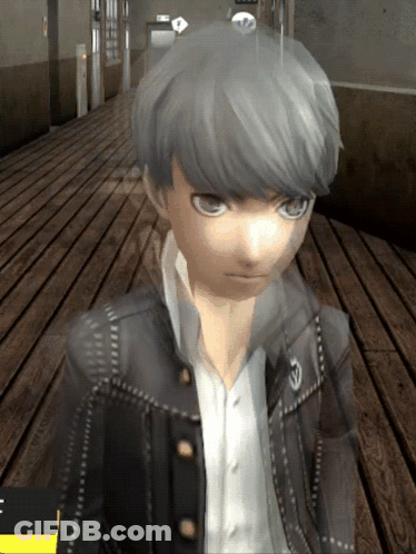 A Boy With Gray Hair Is Standing On A Wooden Floor In A Hallway GIF