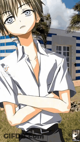 A Boy With His Arms Crossed Is Standing In Front Of A Striped Building GIF