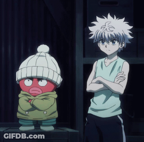 A Boy With His Arms Crossed Is Standing Next To A Red Cartoon Character GIF