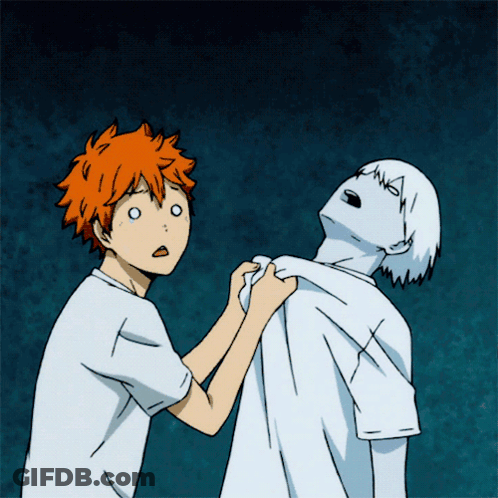 A Boy With Orange Hair Is Holding Another Boy 'S Arm GIF