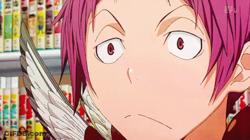 A Boy With Pink Hair Is Holding A Bird 'S Wing In Front Of Bookshelves GIF