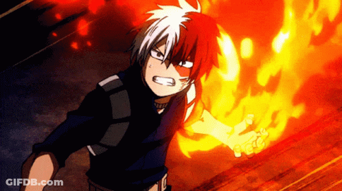 A Boy With Red And White Hair Is Holding A Fireball In His Hand . GIF