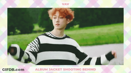 A Boy With Red Hair Is Wearing A Black And White Striped Sweater GIF
