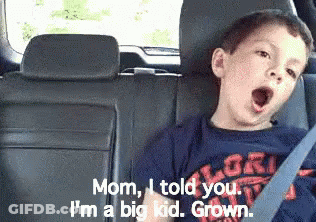 A Boy Yawning In The Back Seat Of A Car GIF