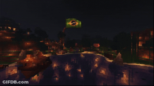 A Brazilian Flag Is Lit Up In The Night Sky Above A Lake GIF