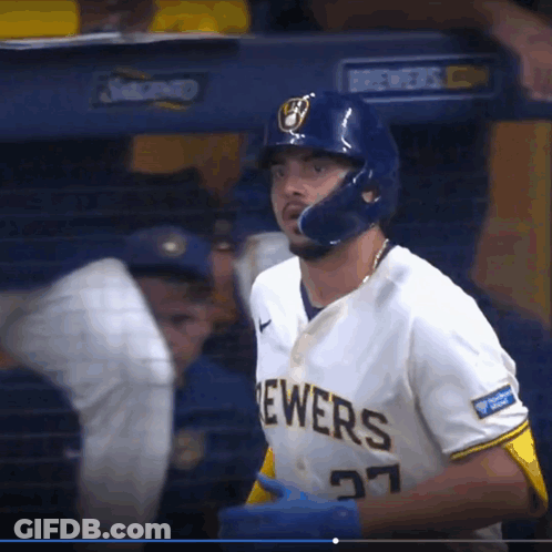 A Brewers Baseball Player Wearing A Helmet And Number 27 GIF