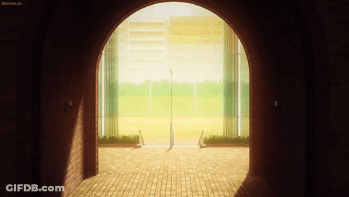 A Brick Archway Leading To A Baseball Field With A Sign That Says Anime.tv GIF