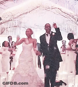 A Bride And Groom Are Dancing In Front Of A Crowd At Their Wedding GIF