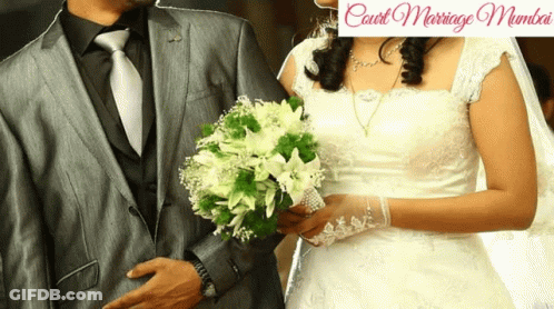 A Bride And Groom Are Standing Next To Each Other With The Words Court Marriage Mumbai In The Corner GIF
