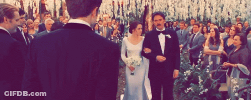 A Bride And Groom Are Walking Down The Aisle At Their Wedding Ceremony GIF