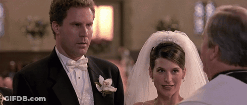 A Bride And Groom Stand In Front Of A Priest At Their Wedding GIF