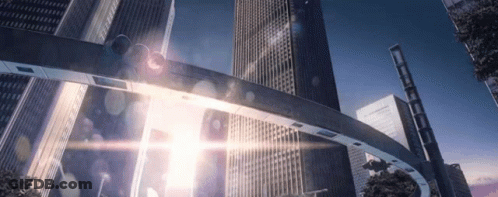A Bridge In The Middle Of A City With A Lot Of Skyscrapers In The Background . GIF
