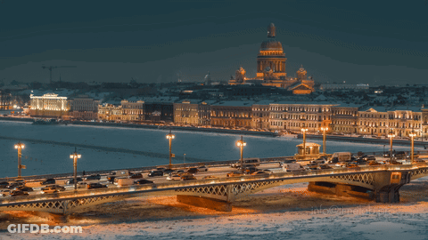 A Bridge Over A Body Of Water With A Large Dome In The Background GIF