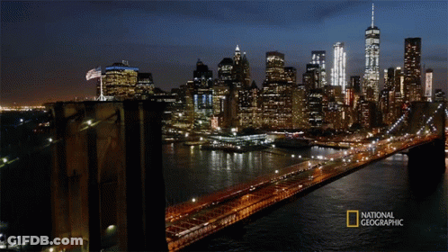 A Bridge Over A Body Of Water With A National Geographic Logo On The Bottom GIF