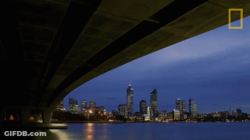 A Bridge Over A Body Of Water With The National Geographic Logo In The Corner GIF