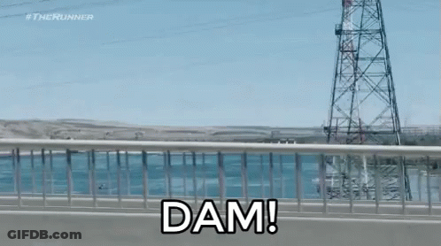 A Bridge Over A Body Of Water With The Words Dam On It GIF