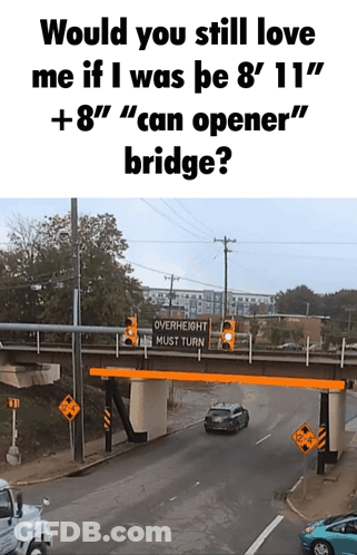 A Bridge With A Sign That Says " Overheight Must Turn " On It GIF