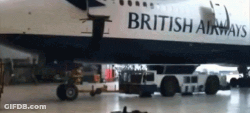 A British Airways Airplane Is Parked In A Hanger GIF