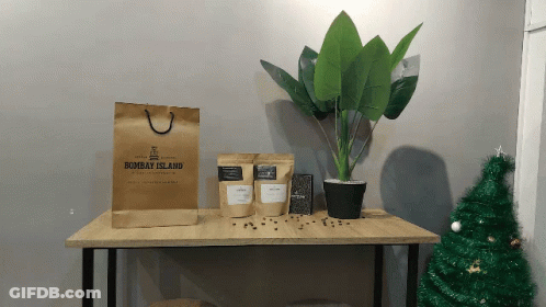 A Brown Bag From Bombay Island Sits On A Table GIF