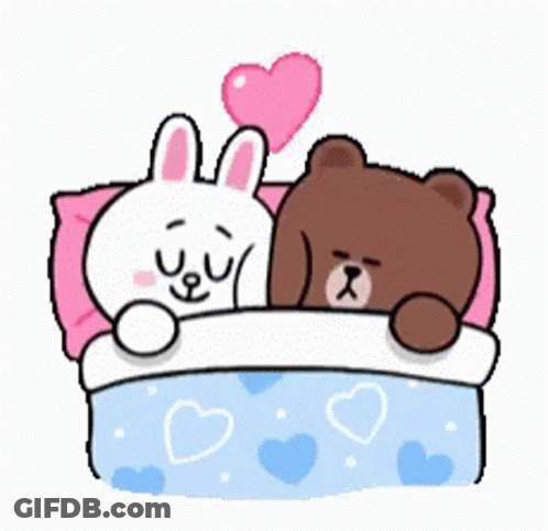 A Brown Bear And A White Rabbit Are Laying In A Bed With Hearts On The Sheets . GIF