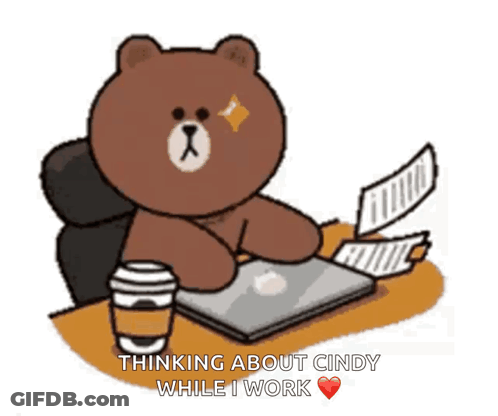 A Brown Bear Is Sitting At A Desk With Papers And A Cup Of Coffee GIF
