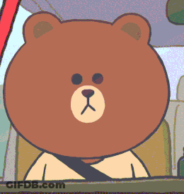 A Brown Bear Is Wearing A Seat Belt And Giving The Middle Finger GIF