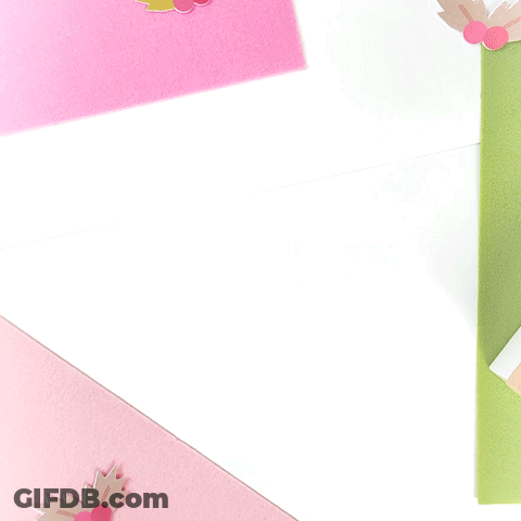 A Brown Envelope With A Pink Ribbon Tied Around It GIF