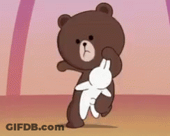 A Brown Teddy Bear Is Holding A White Rabbit In His Paws . GIF