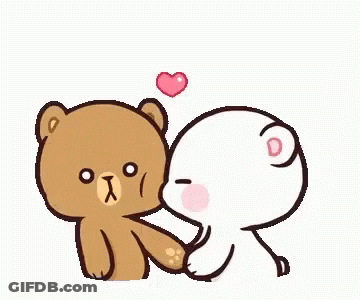 A Brown Teddy Bear Is Kissing A White Teddy Bear With A Heart On Its Head . GIF