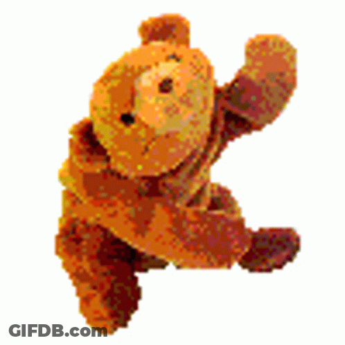 A Brown Teddy Bear Is Waving Its Arm In The Air . GIF