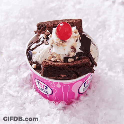 A Brownie Sundae With A Cherry On Top In A Pink Baskin Robbins Cup GIF