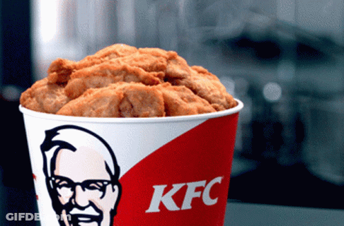 A Bucket Of Kfc Fried Chicken With A Picture Of Mr. Kentucky On It GIF