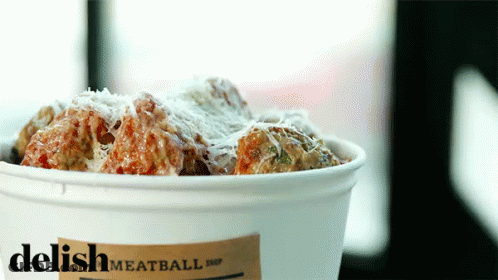A Bucket Of Meatballs With A Label That Says Delish Meatball Shop GIF